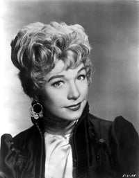 Shirley MacLaine portrait in black dress with hoop earrings photo print.