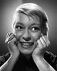 Carol Channing smiling photo print with hands on face.