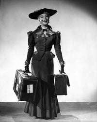 Photo print of Carol Channing smiling in a long dress with Apache cases.