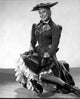 Classic photo print of Carol Channing seated in a timeless pose
