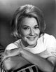 Hope Lange leaning on a printed couch photo print.
