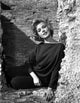 Sandra Dee wearing a black fit long sleeve outfit - Photo Print