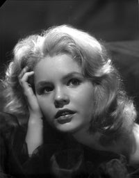 Close-up portrait of Tuesday Weld in black and white photo print.