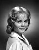 Smiling portrait of Tuesday Weld in black and white photo print.