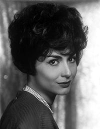 Photo print of Carol Lawrence posed in a necklace, showcasing elegance and style.