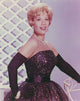Dinah Shore portrait photo print in black dress, showcasing her elegance.