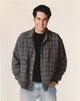 Portrait photo print of Jonathan Silverman in a checkered coat.