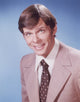 Portrait photo print of Marc Singer in gray coat, available in multiple sizes.