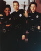 Sirens TV group portrait photo print featuring cast in police officer uniforms.