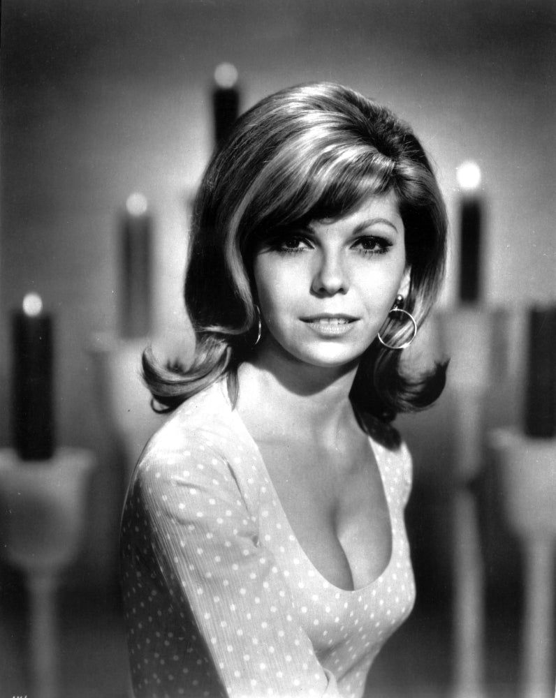 Iconic portrait of Nancy Sinatra in classic photo print.
