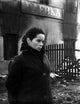 Geraldine Chaplin wearing a black fur coat in a side view photo print.
