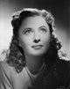 Close-up portrait photo print of Barbara Stanwyck capturing classic Hollywood elegance.