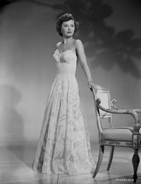 Barbara Stanwyck classic portrait photo print in a chair.