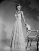 Barbara Stanwyck classic portrait photo print in a chair.