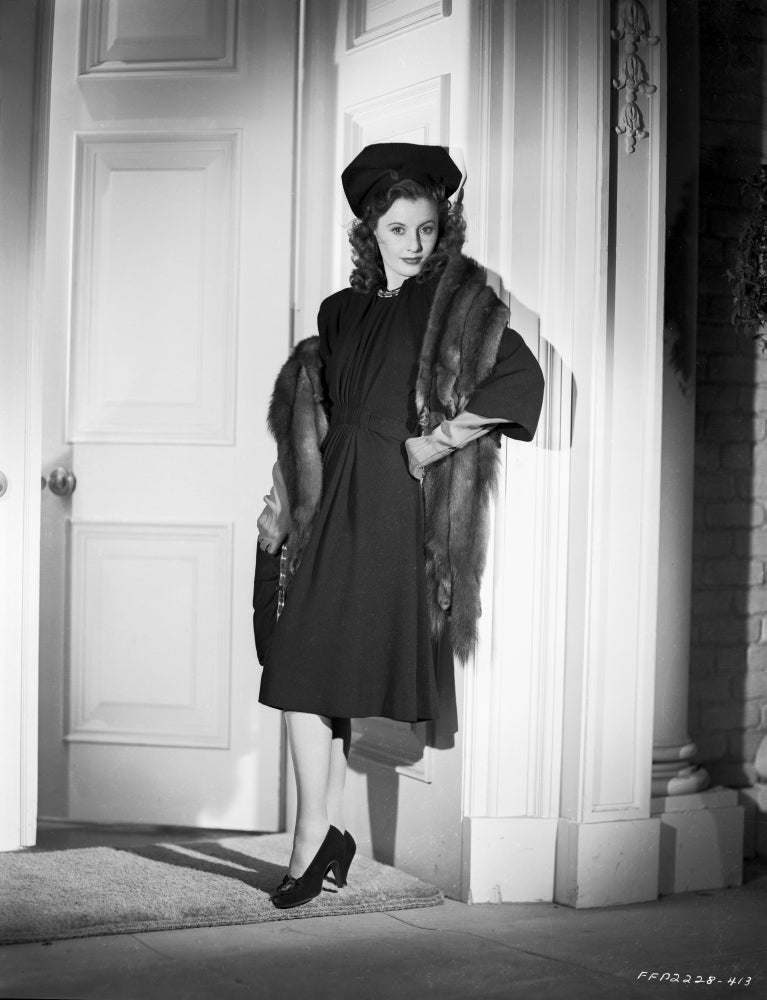 Barbara Stanwyck leaning on post in fur coat classic portrait photo print