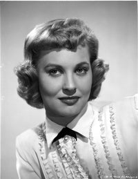 Lola Albright wearing a white blouse photo print in classic style.