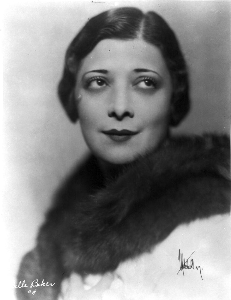 Belle Baker close up portrait with eyes looking up in black fur boa photo print.