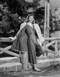 Barbara Stanwyck leaning against a fence classic portrait photo print.
