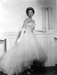 Gogi Grant smiling in a white gown photo print