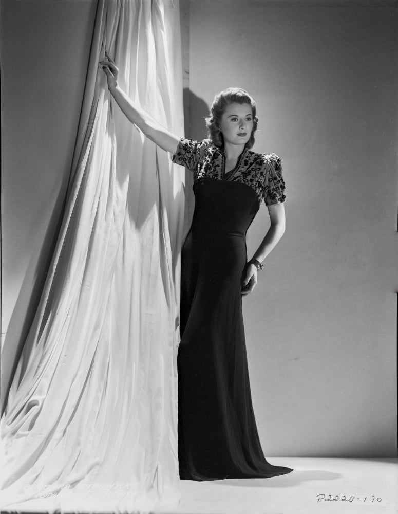 Barbara Stanwyck leaning pose in a long black gown photo print