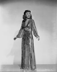 Barbara Stanwyck classic portrait photo print in a dangling long dress.