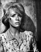 Inger Stevens leaning on a wall in a printed dress photo print.