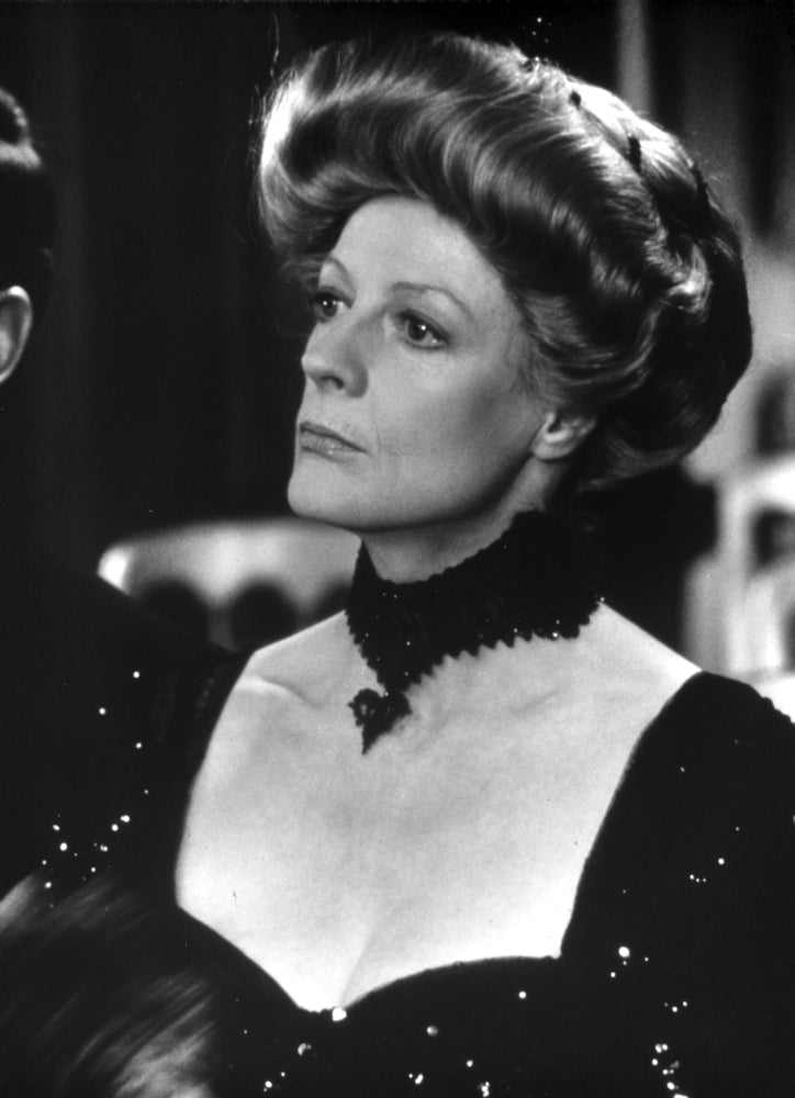 Maggie Smith looking away in a black dress with black necklace photo print.