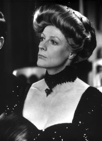 Maggie Smith looking away in a black dress with black necklace photo print.