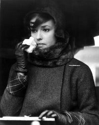 Jeanne Moreau candid portrait photo print featuring black linen top and black scarf.
