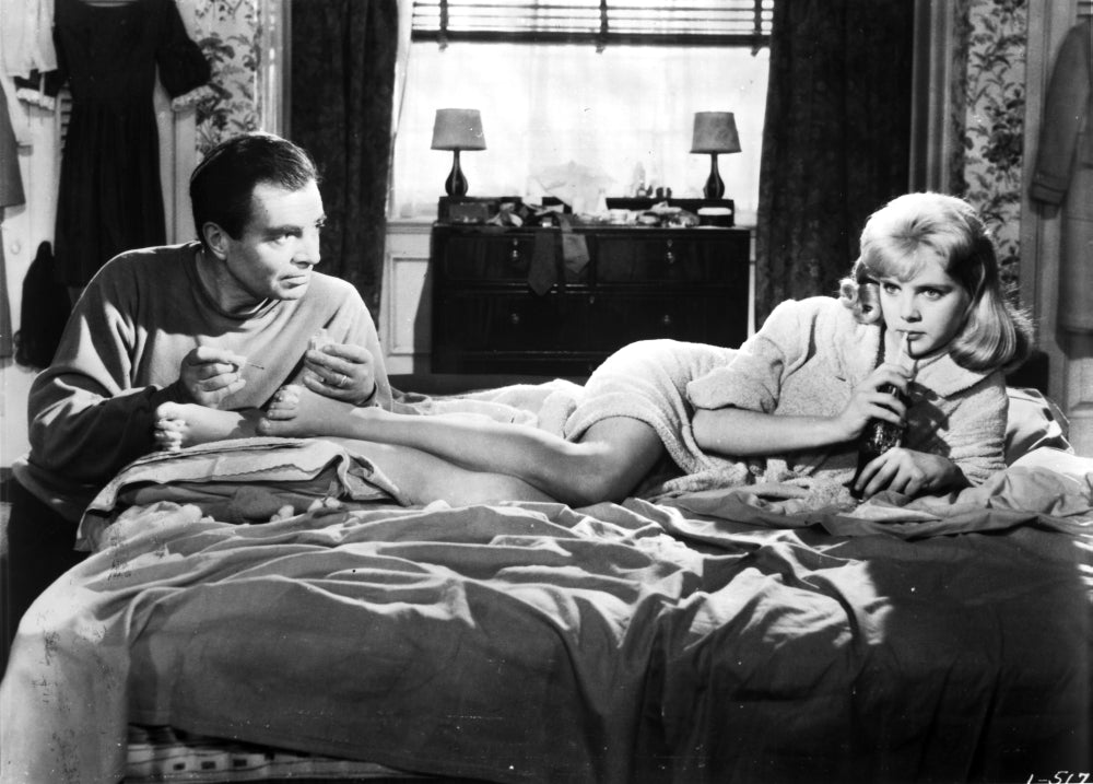 Sue Lyon film still photo print of actress lying on bed.