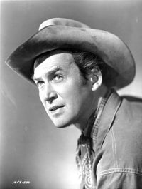 James Stewart portrait photo print in denim collar shirt and cowboy hat looking up.
