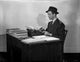Classic portrait photo print of James Stewart working at his desk