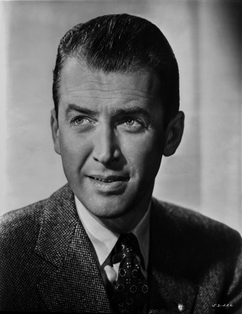 James Stewart portrait in grey linen sport coat and black silk necktie.