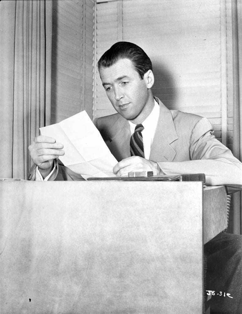 James Stewart classic portrait photo print in a reading pose.