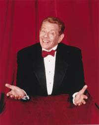 Jerry Stiller photo print in black suit and red bow tie on red background