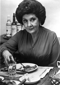 Maureen Stapleton photo print dining in a black blouse.