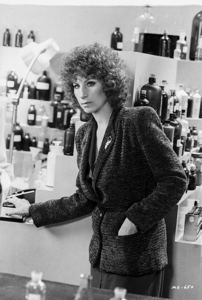 Barbra Streisand leaning on a counter photo print