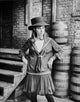 Barbra Streisand posed in school uniform with hat photo print