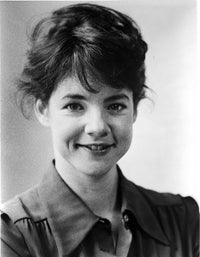 Close-up black and white portrait of Stockard Channing wearing formal dress