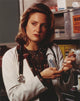 Sherry Stringfield portrait in medical uniform holding a syringe photo print.