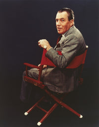 Ed Sullivan seated photo print with blue background