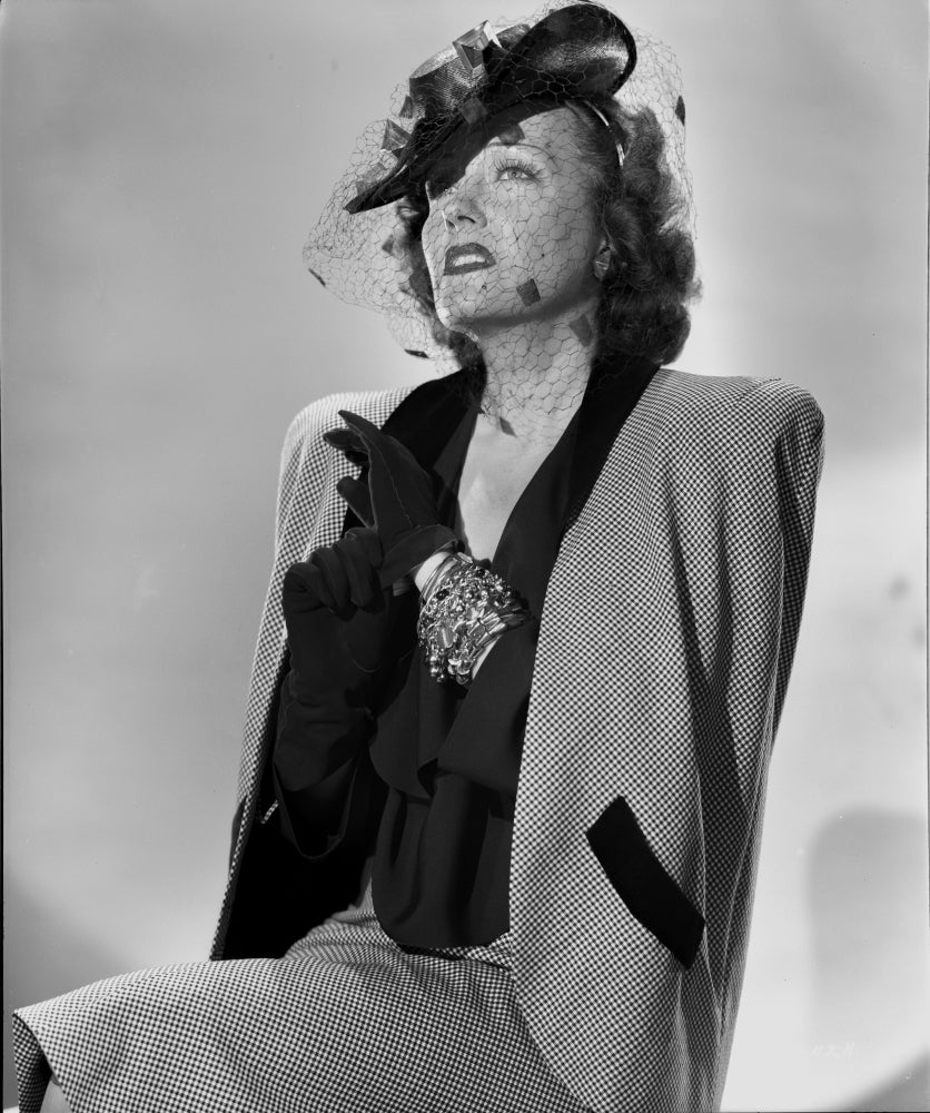 Elegant portrait of Gloria Swanson in formal outfit photo print.