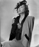 Elegant portrait of Gloria Swanson in formal outfit photo print.