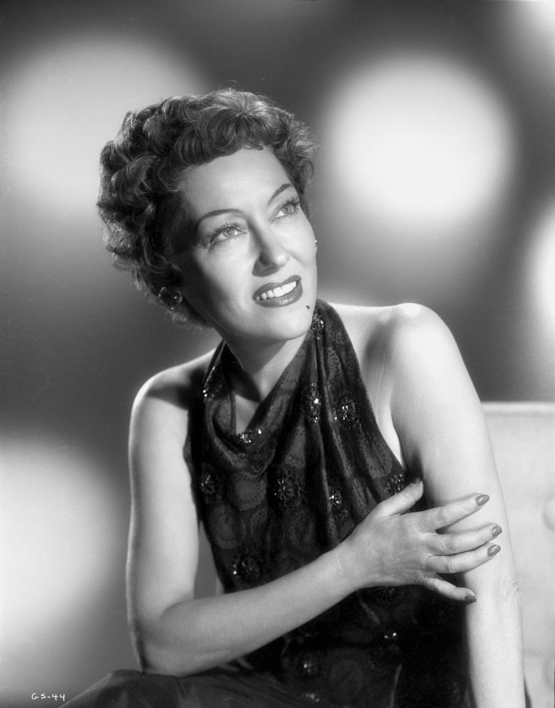 Gloria Swanson in black gown with red lipstick and curly hair photo print.