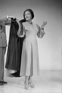 Gloria Swanson Black Coat Photo Print capturing classic Hollywood elegance.