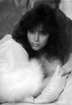 Rachel Ward leaning on couch with fur scarf black and white portrait photo print.