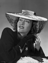 Gloria Swanson Looking Up in Black Dress with Hat Photo Print