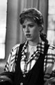 Molly Ringwald portrait photo print wearing black vest with plaid sleeves