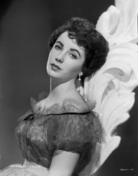 Elizabeth Taylor leaning in dress photo print showcasing classic Hollywood glamour.