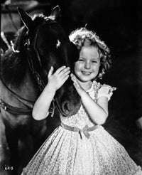 Shirley Temple Playing Horse in Floral Dress Photo Print